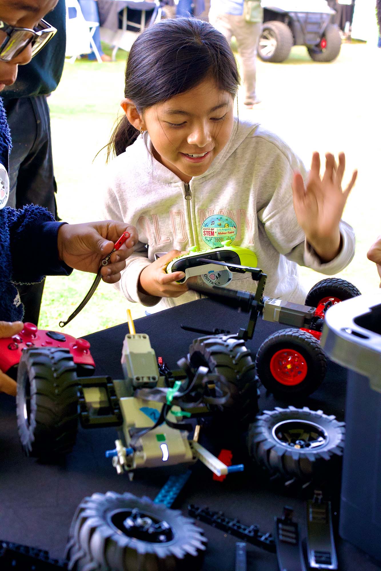 Player controlling a LEGO robot at a RoboBattles arena